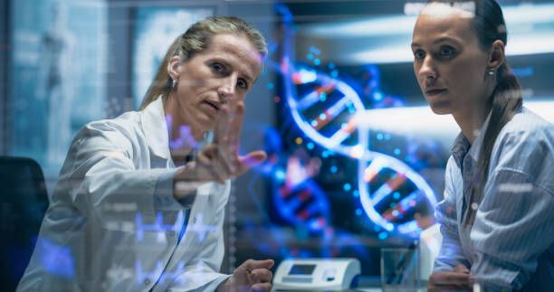 Two researchers discussing a DNA visualization